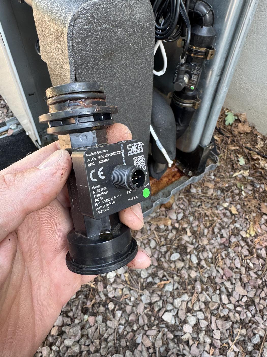 Failed flow switch removed from a heat pump during a service, on a system installed by another company