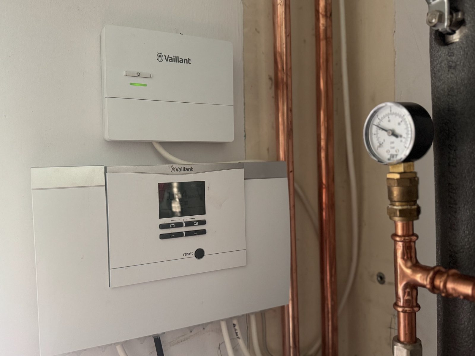 Cylinder controls and system pressure gauge being read during an annual service